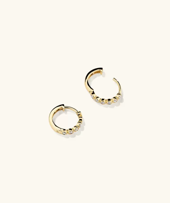 Shop Bezel Lab Grown Diamond Huggies Earrings
